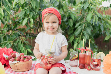 Strawberry and mint infused detox water. strawberry lemonade with ice and mint as summer refreshing drink in jars. Cold soft drinks with fruit.