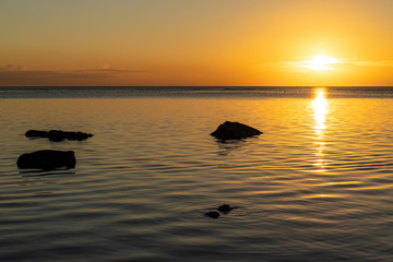 Fototapeta na wymiar Sunset on the beach on Mauritius Island