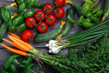 Vegetables on the black background. Organic foods and fresh vegetables.