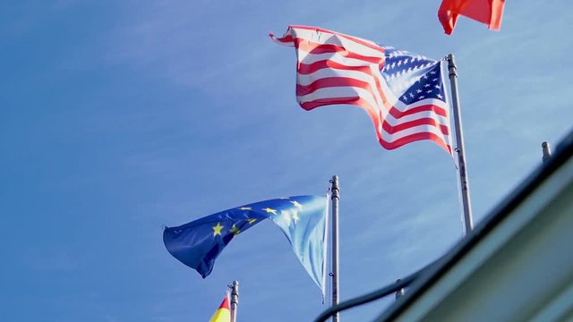 Flags of the USA and the European Union. Suitable for America and Europe agreement or disagreement in the global trade wars. Slow motion from 120 fps original clip