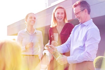 Business people on a rooftop party.