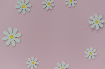 Naklejka na ściany i meble Beautiful pink background with daisies. Texture for creative ideas. The concept of lightness and minimalism in design