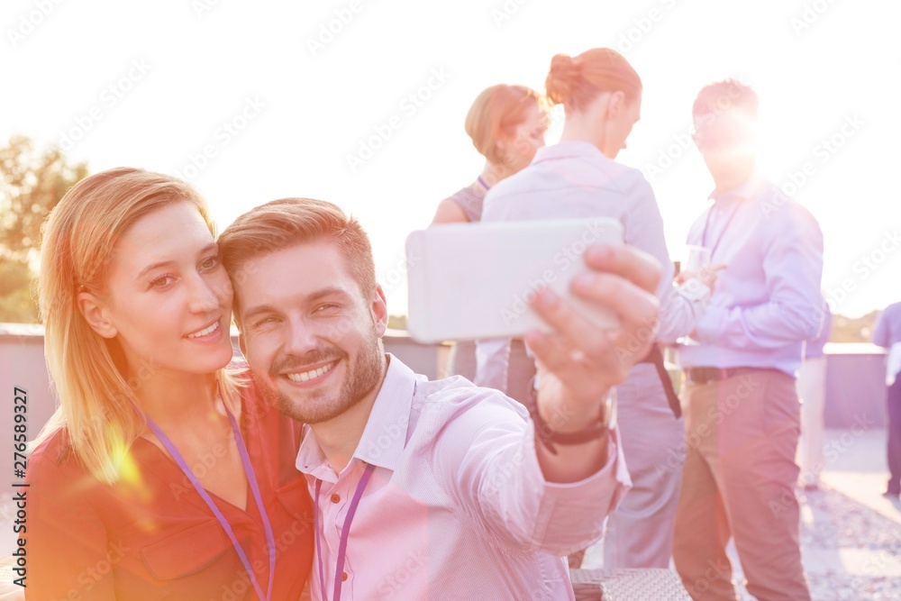 Wall mural business people on a rooftop party.