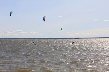 Athlete on a parachute surfboard on sea