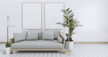 Poster above white sofa with frame in simple zen living room interior.3D Rendering