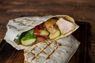 Tortilla wraps with meat and vegetables.
