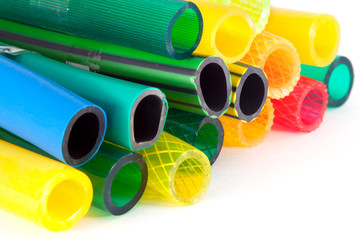 colorful gardening hoses on white background