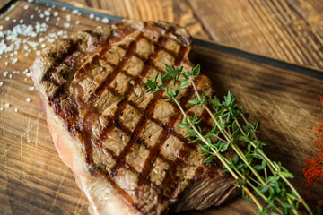 Grilled meat on a wooden table.