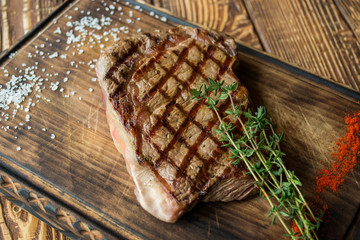 Grilled meat on a wooden table.