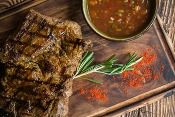 Grilled meat on a wooden table.