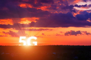 5G rises above the horizon. Network wireless systems and internet of things on surise background. Concept of future technology