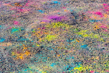 Colorful asphalt after festival of colors Holi.