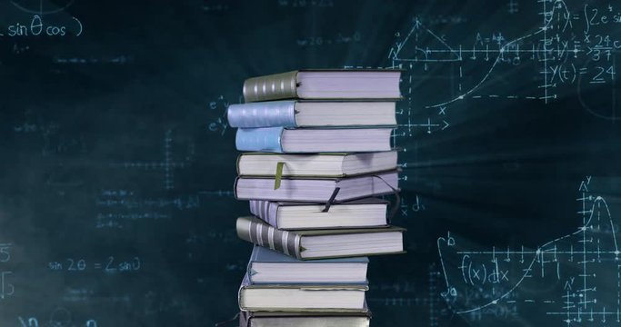 Pile of books and mathematical equations and graphs