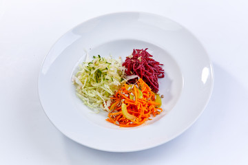 slice fresh vegetables on the white plate