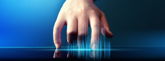 Hand pressing a button on a tablet computer