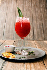 Lemonade or juice. Alcohol drink or cocktail. Images for bar or restaurant menu. Red drink with ice lemon and berries