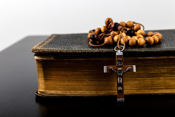 Rosary beads and prayer book.