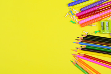 Different colorful School supplies on yellow background. Back to school sale, sopping concept.  Copy space