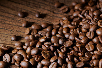 Roasted coffee beans on wooden table