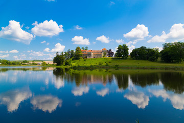 Fototapeta na wymiar Old beautiful Svirzh castle, surrounded by lake . Ukraine
