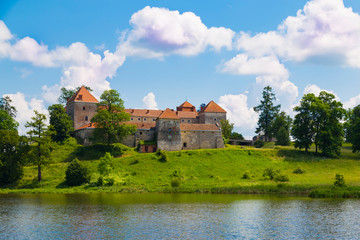 Naklejka na ściany i meble Old beautiful Svirzh castle, surrounded by lake . Ukraine