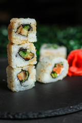 Sushi maki rolls (tuna, salmon, shrimp, avocado and other ingredients). japanese food. Top view, assorted sushi, all you can eat menu. copy space