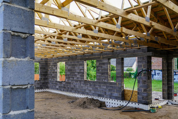 Concrete foundation of a new house, view of construction site in preparation process