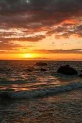 Fototapeta na wymiar sunset on the beach of Hawaii
