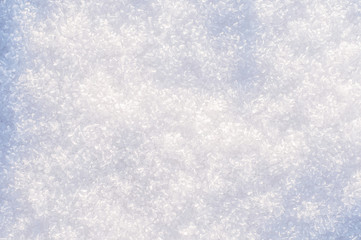 winter background, snow texture. snowflakes close up. shiny snowflakes in the rays of the sun
