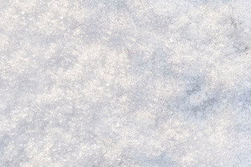 winter background, snow texture. snowflakes close up. shiny snowflakes in the rays of the sun