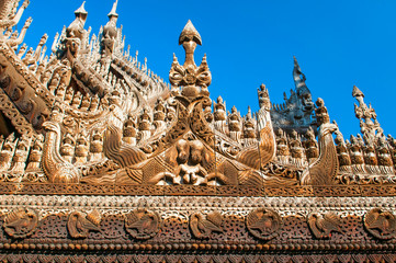 Carvings on top of Shwenandaw Kyaung Temple or Golden Palace Monastery in Mandalay, Myanmar.