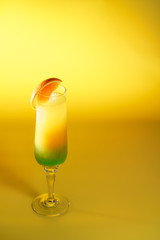 Moscow Lights cocktail in a champagne glass garnished with an orange slice