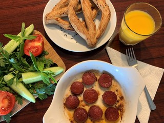 Turkish breakfast with sujuk and orange juice. Sujuk is a dry, spicy sausage which is eaten from the Balkans to the Middle East and Central Asia. 