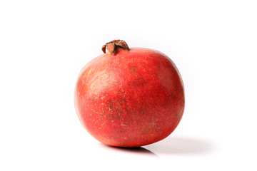 whole pomegranate isolated on white background