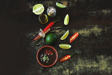 Chili lime sauce Ingredients for chili sauce and lime. Chili, limes and spices. Vegan food. Dietary healthy food. Copy space. Flat Lay.