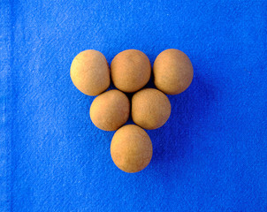 Longan fruits on blue background.