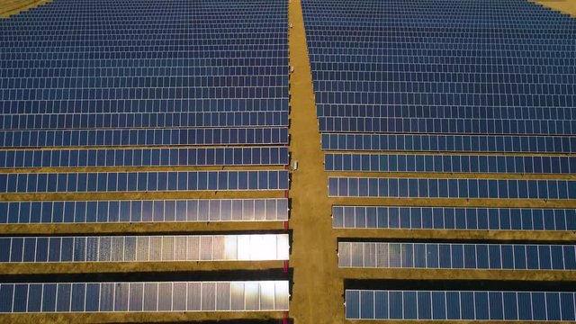 Solar Panels Aerial View Drone In the Desert at Noon Super Hot Day Alternative Energy 4K close green energy top view 90 deg.mp4