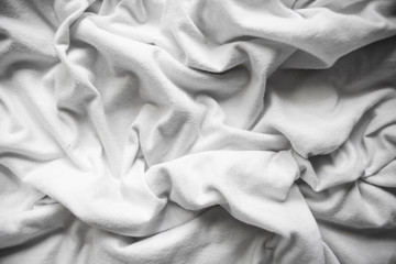 texture background cotton folds of white fabric