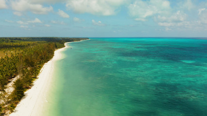 Travel concept: blue sea and sand beach on a tropical island. Punta Sebaring, Balabac, Palawan. Summer and travel vacation concept.