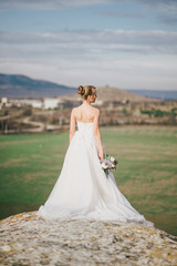 Fototapeta na wymiar Beautiful bride with wedding bouquet