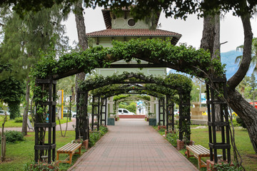 Green square wooden arch in park in Kemer, Turkey