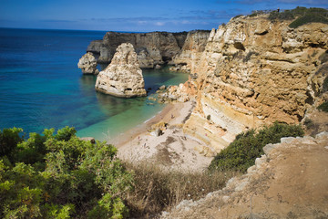Fototapeta na wymiar Top view on cliffs around Marinha beach in Albufeira, Portugal