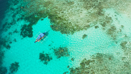 Fototapeta na wymiar Sea water surface in lagoon with coral reef copy space for text. Top view transparent turquoise ocean water surface. background texture