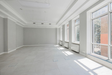 office for negotiations with unfurnished customers with a large number of windows in the office building