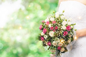 Bride with beautiful wedding bouquet, isolated on white background