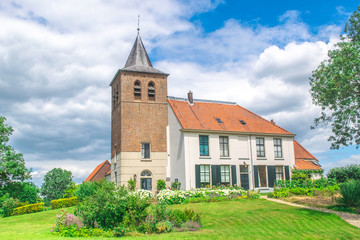 A old traditional Dutch church in the village of Ooij, Holland