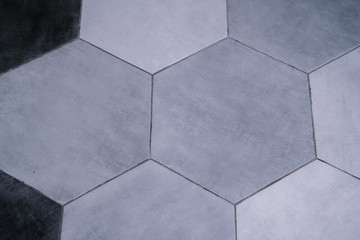 Floor pattern in gray hexagonal tiles