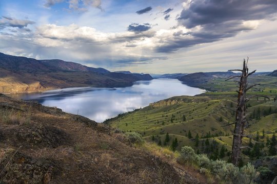 Sweeping Kamloops Lake Viewpoint on Trans-Canada Highway and Dramatic Sky Landscape, Interior of British Columbia, Canada