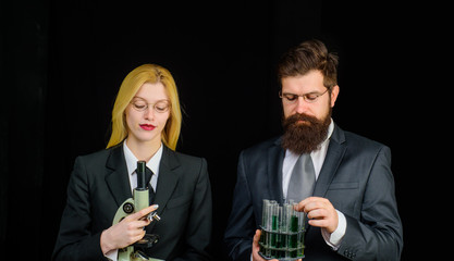 Laboratory assistants with test tubes and microscope. Chemistry science. Chemistry lesson. Lab experiment. Students in university laboratory. Scientists working in laboratory. Chemistry demonstration.