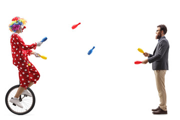 Clown on a unicycle juggling with a bearded man